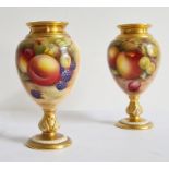 A matched pair of two Royal Worcester fruit painted oviform vases, the first with printed  purple