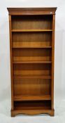 20th century yew open bookcase raised on bracket feet, 78cm x 181.5cm