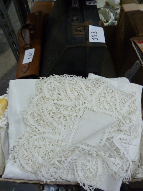 Quantity of table linen, lace, other linens, an accordion, a portable typewriter, a leather