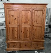 20th century pine triple wardrobe with three drawers under, on plinth base, 172cm x 198cm