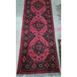 Eastern runner with four central medallions in red and black, 286 x 76 cm