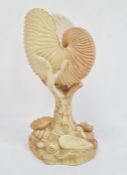 Royal Worcester nautilus shell, blush ivory ground on a rocky shell moulded base, enriched in