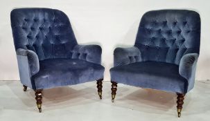 Pair of salon chairs in blue ground buttonback upholstery, turned front legs terminating to brass