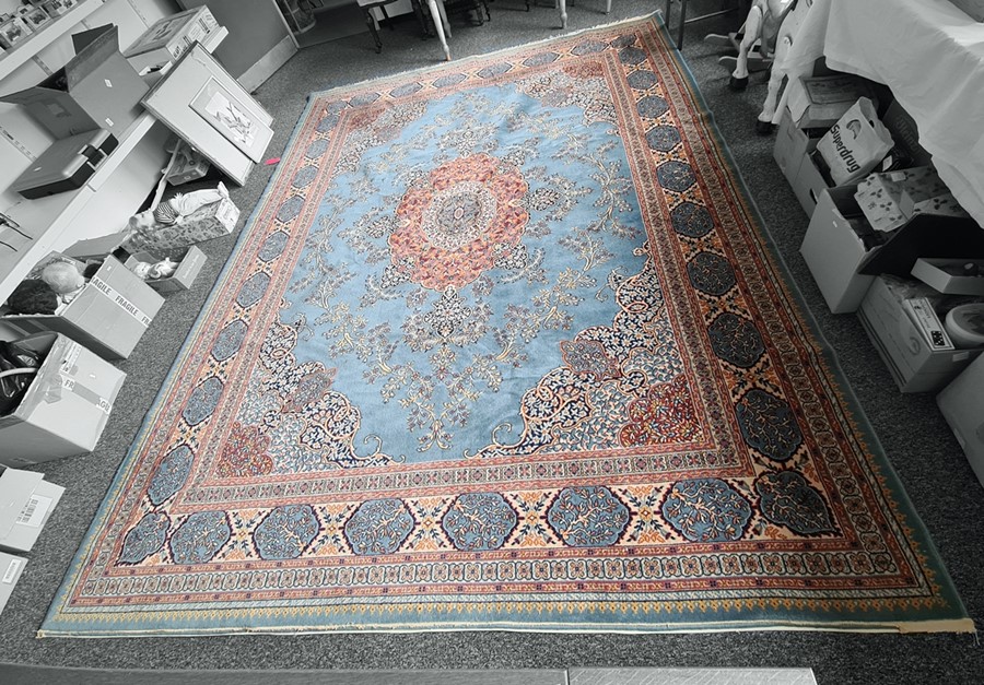 Persian rug, the central stepped foliate medallion on a light blue field, stepped foliate spandrels,