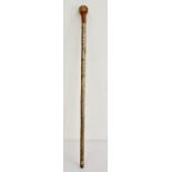 Varnished wood walking stick with a yew knob handle
