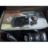 Vintage cameras including two 8mm movie cameras, a camera tripod, a Pentax zoom 105 in original box,