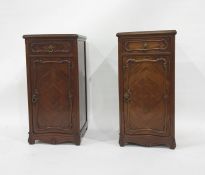 Pair of walnut pot cupboards in the French-taste, the rectangular top with moulded edge, single
