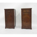 Pair of walnut pot cupboards in the French-taste, the rectangular top with moulded edge, single