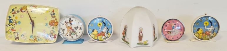 Two Smiths Sooty and Sweep alarm clocks, a Bambi Disney alarm clock made by Bayard, a Cinderella