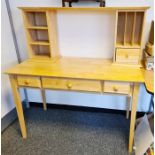 Beech desk, the top with assorted pigeonholes, the base with three drawers, on square section