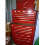 Red Snap-On tool chest with cabinet over six small drawers and three longer drawers, on top of