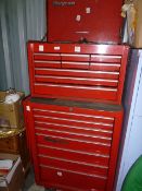 Red Snap-On tool chest with cabinet over six small drawers and three longer drawers, on top of