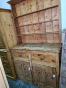 19th century pine dresser with open shelves above two drawers and two cupboard doors, 126cm x 214cm