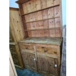 19th century pine dresser with open shelves above two drawers and two cupboard doors, 126cm x 214cm