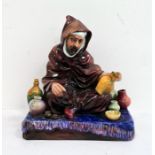 Royal Doulton pottery seated figure 'The Potter' HN1493, 17cm wide