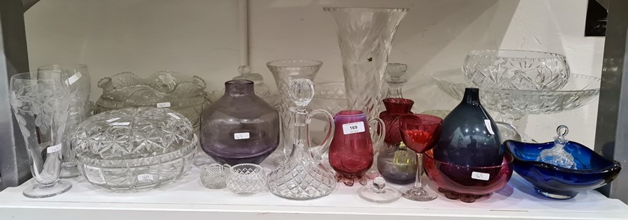 Cranberry glass cream jug with ribbed border, two cranberry glass bowls, an amethyst glass studio