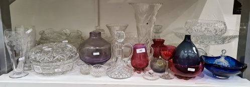 Cranberry glass cream jug with ribbed border, two cranberry glass bowls, an amethyst glass studio