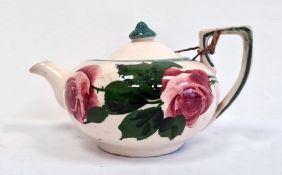 Llanelly pottery compressed globular teapot and cover, printed black marks, painted with pink rose s