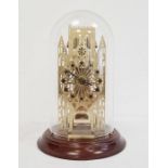 Modern York Minster skeleton cathedral clock by Franklin Mint, with glass domed top, on mahogany