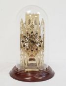 Modern York Minster skeleton cathedral clock by Franklin Mint, with glass domed top, on mahogany