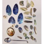 White metal spoon in the form of a golf club and a collection of iridescent mother-of-pearl pendants