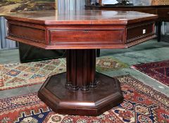 19th century mahogany octagonal-topped rent table, the plain edge above four drawers, on a single