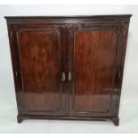19th century mahogany cupboard, the rectangular top with moulded edge above two doors enclosing