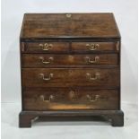 19th century oak bureau of four long graduated drawers, to bracket feet, 85.5cm x 104cm