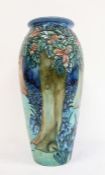 Moorcroft pottery tall ovoid vase with tube-lined decoration of woodland trees and bluebells,