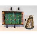 Toy dalek and a miniature table football game