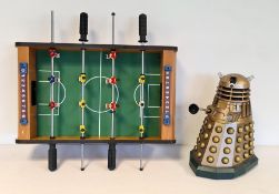 Toy dalek and a miniature table football game