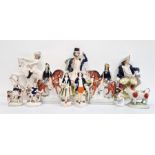 Large quantity of Staffordshire pottery flatback figures to include highlander with dog, seated