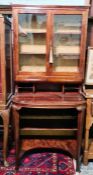 Early 20th century mahogany cabinet with two glazed doors enclosing shelves, above pigeonholes, desk