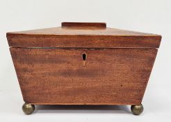 19th century mahogany sarcophagus-shaped tea caddy, the hinged top opening to reveal compartmented