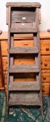 Set of folding wooden steps stamped to side 'Cirencester Brewery Ltd' together with a coal helmet
