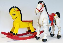 Metal Mobo-type rocking horse and a painted wooden rocking horse (2)  Condition ReportPlease see