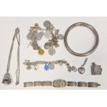 Hollow silver bangle, a silver charm bracelet, various charms, etc