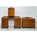 20th century pine dressing table, a chest of three drawers and a beside chest of three drawers (