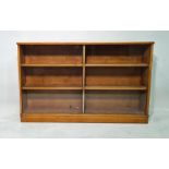 20th century oak low bookcase with glass sliding doors enclosing shelves, plinth base, 138cm x 86cm