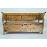 Possibly 19th century and later pine bench with panelled back and sides, with lift-top seat,