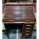 20th century oak roll-top desk on base with eight drawers, raised on plinth, 90cm x 116cm