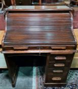 20th century oak roll-top desk on base with eight drawers, raised on plinth, 90cm x 116cm