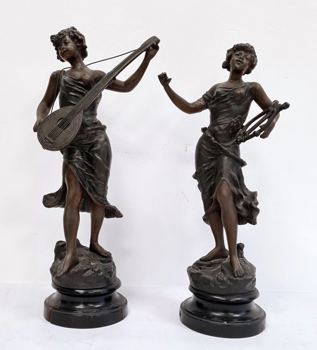 Pair of spelter figures of ladies playing musical instruments, stamped 'TR Richard'  Condition