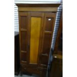 Early 20th century single door oak wardrobe with drawer under, on stile supports, 193cm x 81.5cm
