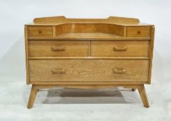 Mid century oak dressing table, the rectangular top with curved recess, the base with two drawers