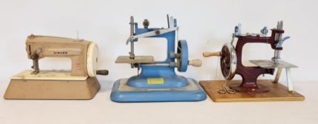 Child's Vulcan sewing machine in blue, another in red and a child's Singer sewing machine (3)