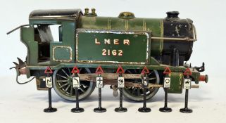 Hornby clockwork 0 gauge train marked LNER 2162 and a small quantity of vintage model train track