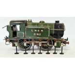 Hornby clockwork 0 gauge train marked LNER 2162 and a small quantity of vintage model train track