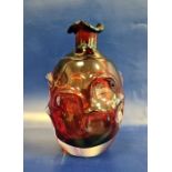 Ruby red Art glass of Whitefriars 'Knobbly' type, of bottle-shaped form with petal-shaped everted