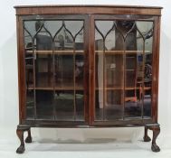 20th century mahogany bowfront display cabinet with two astragal glazed doors enclosing shelves,